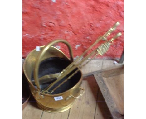A brass coal scuttle, a set of brass fire irons, and an HMS Victory toasting fork