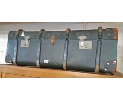 A vintage wood and metal bound travelling trunk with studded leather corners