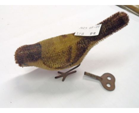 A vintage Schuco clockwork toy bird - working