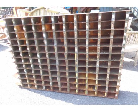 A vintage green painted metal workshop pigeon-hole unit