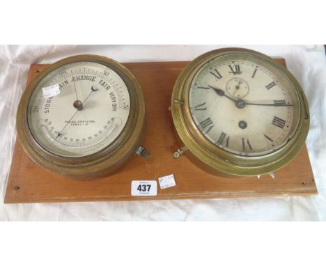 A 7 1/4" diameter brass cased aneroid bulkhead barometer by Pascall Atkey &amp; Son., Cowes with curved temperature scale und