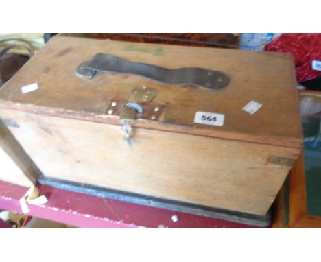 A vintage wooden shoe-shine box with some contents