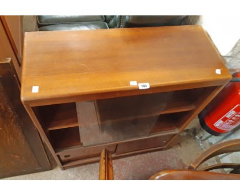 A 30" retro teak effect book cabinet with sliding glass doors to top and and sliding wood doors under, set on bracket base