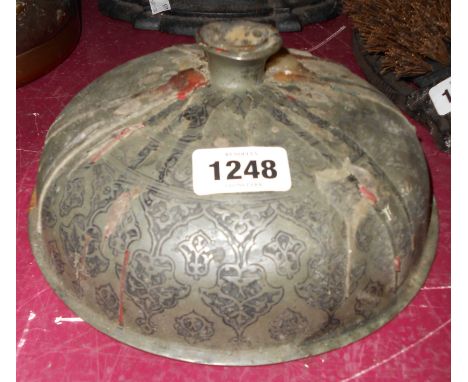 An antique Persian lid as a candlestick