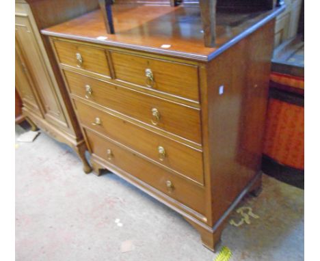 A 36" Georgian style mahogany chest with blind fretwork low raised back, two short and three long graduated drawers bearing J