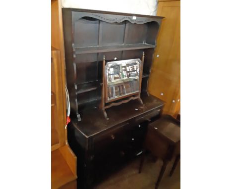 A 3' 8" Ercol dark stained elm two part dresser with two shelf open plate rack over a base with two short drawers and pair of