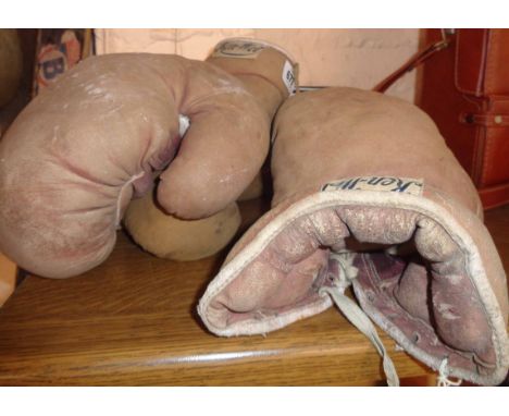A pair of vintage Kenwell boxing gloves - sold with a smaller pair