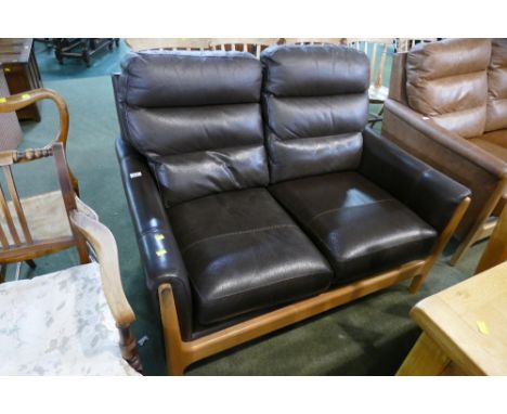 Modern dark brown wooden framed two seater settee 