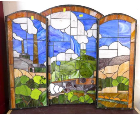 Sections of triple stained glass and leaded folding screen decorated with steam trains and industrial scenes 