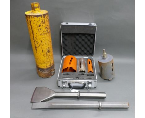 Selection of core drill bits and two breaker chisels. 