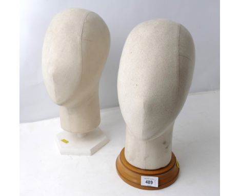 Two mannequin dummy heads by Stockman of London on wooden stands 