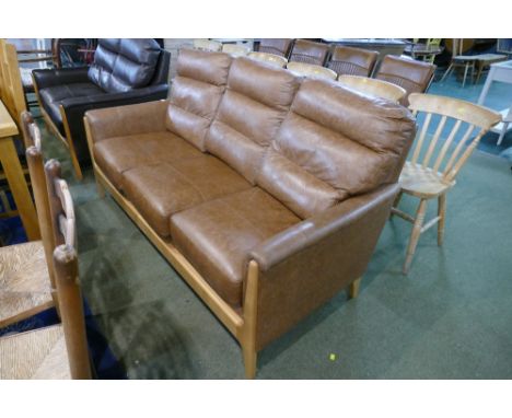Modern brown wooden framed leather three seater settee 