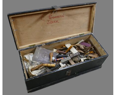 Vintage carpenters toolbox containing selection of tools. 