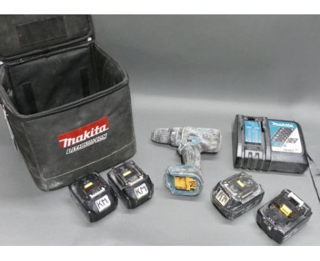 Makita DHP480 cordless drill with charger and 4 18v batteries. 