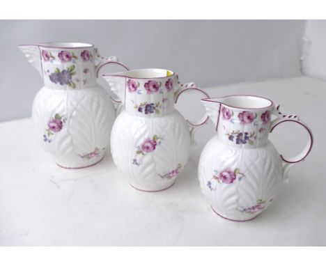 Graduated set of Coalport Caughley Mask Head jugs 