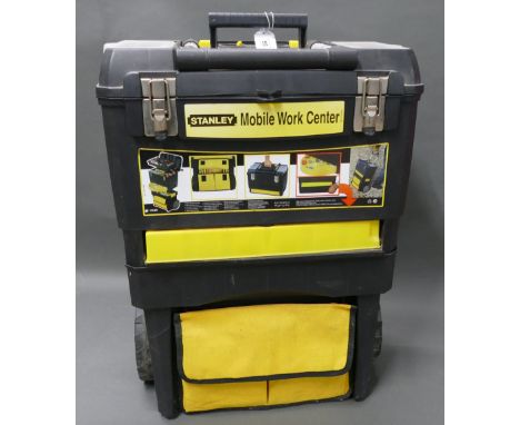 Stanley mobile work center containing quantity of tools. 