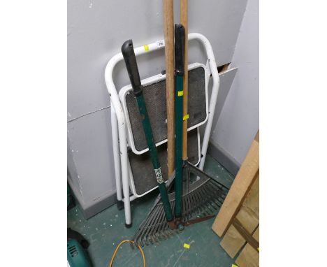 Two stepladders and garden tools 