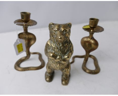 Pair of snake form brass candlesticks and brass bear 