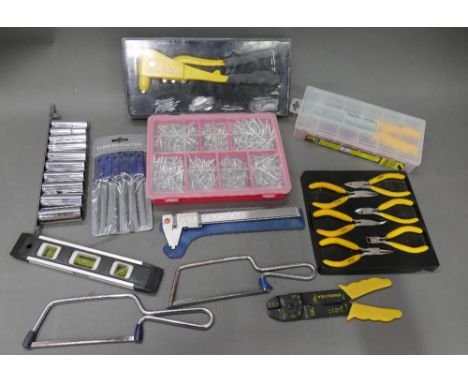 Selection of hand tools that include pot riveter, files, pliers etc.