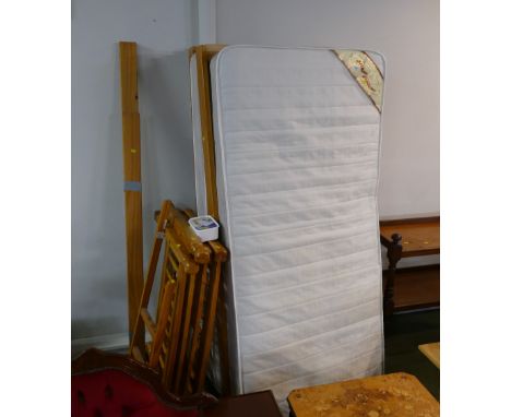 Unassembled bunk bed with mattresses 