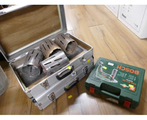 Bosch PSB650 RE drill and two metal cases containing drilling accessories 