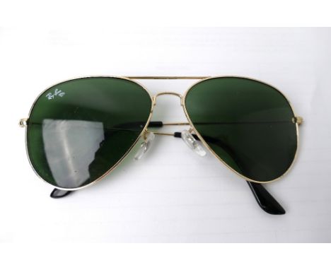 Pair of vintage Ray Ban Aviator style sunglasses with green lenses 