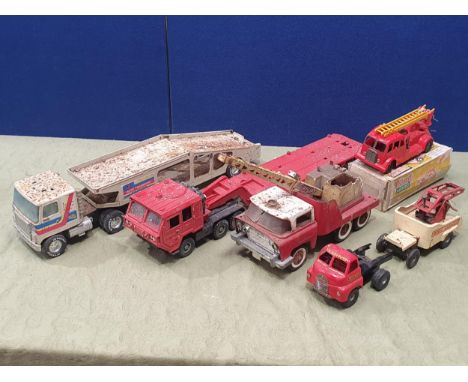 A quantity of Triang Minic and other tinplate Toys including plastic Fire Engine, Minic Garages recovery Crane, Car Transport