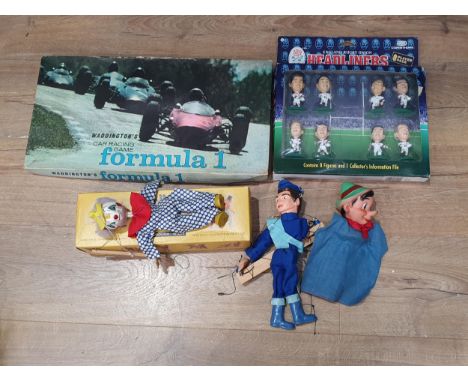 A boxed Pelham 'Jumpette Clown' Puppet, a Thunderbirds Puppet, a Pinocchio Puppet, an England Rugby Headliners Pack and a Wad