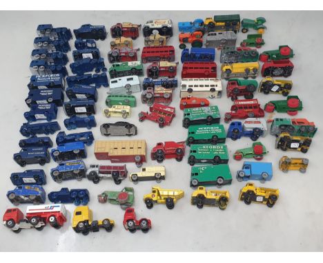 A tray of Lesney Matchbox play worn Vehicles including Pickfords Removal Vans, Buses, Coaches, Dunlop Vans, Ford Tractor, Car