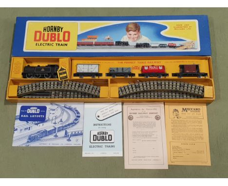 A boxed Hornby Dublo EDG17 Goods Set in long box. Later version with Mobil Tanker. Contents are unused in mint condition. Cha