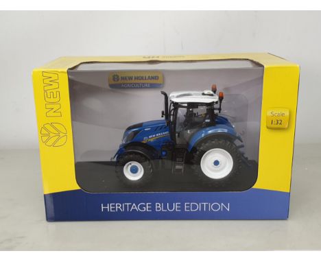 A boxed Universal Hobbies 1:32 scale Heritage Blue Edition New Holland T6.180 Tractor 