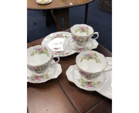 TWO PART TEA SERVICES, comprising 6 cups and saucers by Royal Albert, Moss Rose pattern and 13 cups, 12 saucers and 22 cake p
