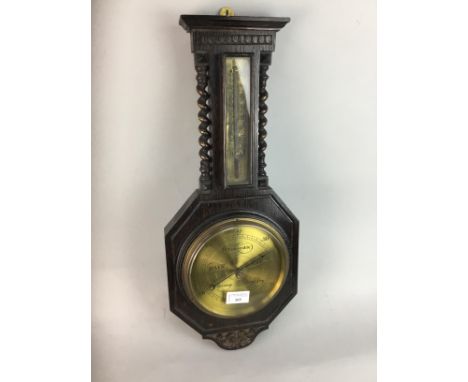 ANEROID BAROMETER WITH THERMOMETER, in an oak case, 55cm high