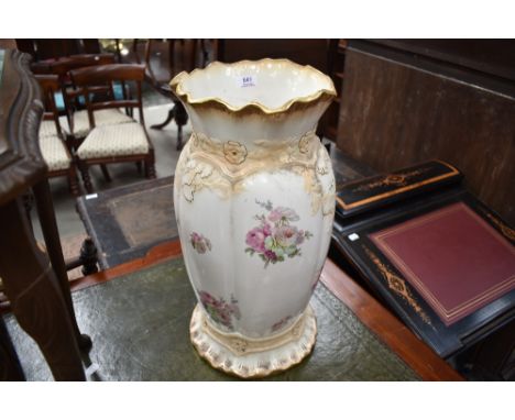 A 20th century Blakeney pottery stick or umbrella stand, of ovoaid form with moulded and flared rim, decorated with foliate s