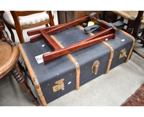 A vintage luggage trunk, and a later luggage stand
