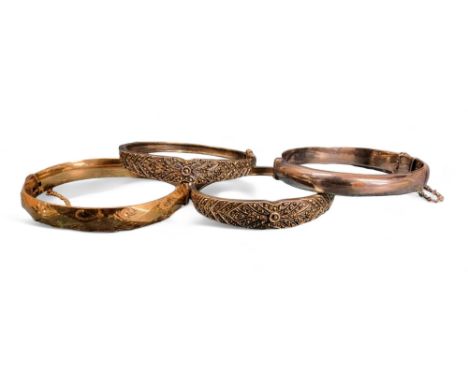 A 9ct rolled gold hinged faceted bangle, engraved with scrolls; a silver hinged bangle, RPH, Birmingham, 1965, 13.94g; a silv