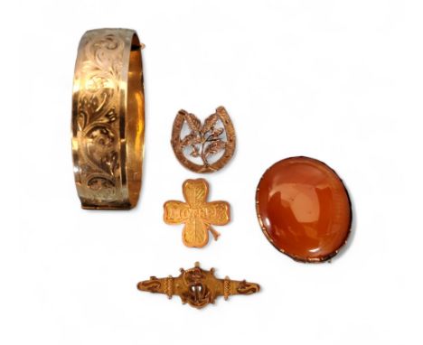 A 9ct gold sweetheart bar brooch surmounted with a an anchor entwined with a heart, metal pin, Chester, 1914, 2.21g gross; a 