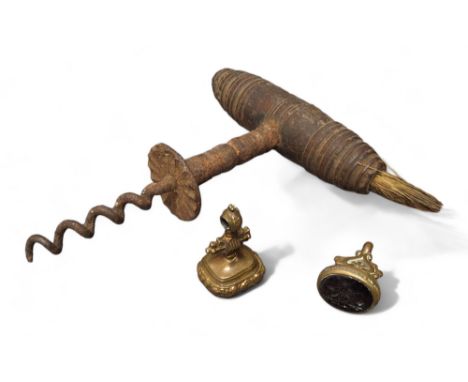 A 19th century corkscrew, turned handle, with brush, 14cm long;&nbsp; a 19th century gilt metal&nbsp; seal; another (3) 