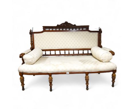 A late Victorian walnut salon sofa, 148cm wide, c.1870 