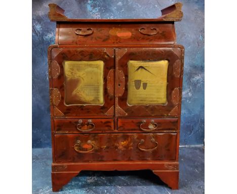 A Chinese red lacquered wooden two-door cabinet, decorated in gilt with flowers and monumental landscapes, 52cm high, 36cm wi