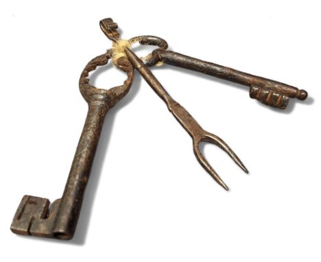 A 17th century cast iron key, 11.5cm long;&nbsp; another;&nbsp; a small fork (3) 