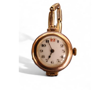A 9ct gold lady's watch, unsigned movement, engraved 417824, white enamel dial, Arabic numerals, 9ct gold case London, 1918, 