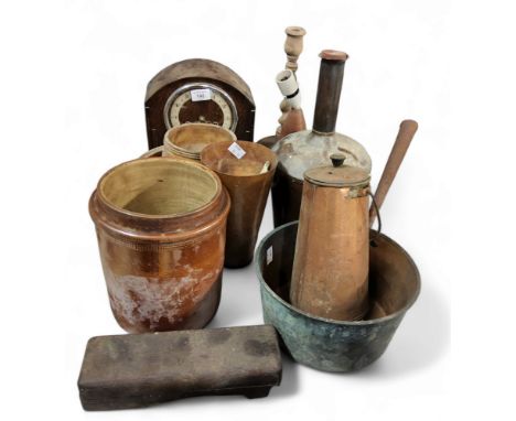 A copper saucepan;&nbsp; a copper storage bottle;&nbsp; a Benitone mantel clock, c.1940;&nbsp; turned wooden candlestick;&nbs