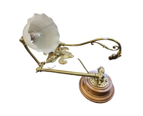 A gilt metal hall table light, with frosted fluted&nbsp; shade, adjustable scroll arm,&nbsp; wooden base, 52cm high;&nbsp; a&