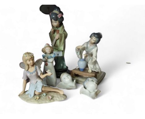 A Lladro figure of a Geisha, standing holding a fan, 32cm high, printed mark;&nbsp; another, of a lady kneeling by a low tabl