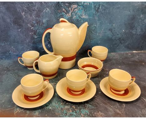 A Susie Cooper Kestrel shape coffee service, banded in tan in and grey, comprising coffee pot, milk jug, sugar bowl, five cup