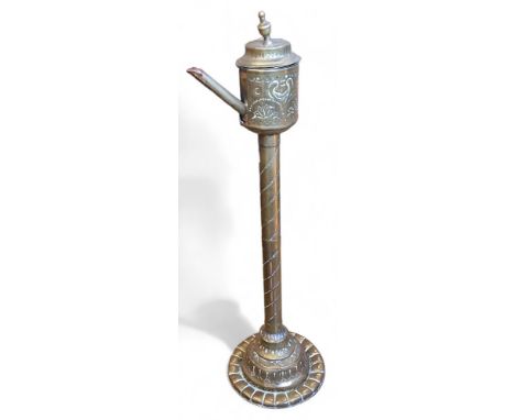 A 19th century brass whale oil lamp, embossed and engraved with scrolls, 59cm high 