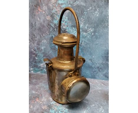 An early 20th century carriage lamp, steel loop handle, 38cm high 
