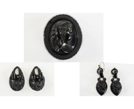 Whitby Jet Portrait Brooch and Two Pairs of Earring Drops, the brooch 2 inches high x 1.5 wide, the drops 2 inches and 1.5 in