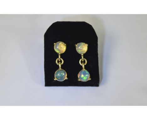 Pair of Natural Opal Drop Earrings, each earring comprising a round cut cabochon opal suspended below a similar stone set in 